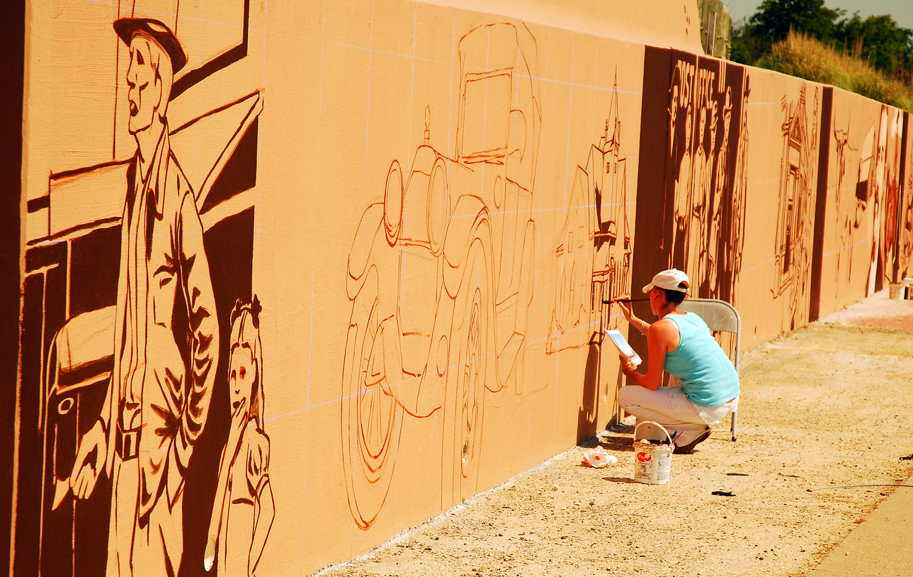 Painting a mural along the interstate